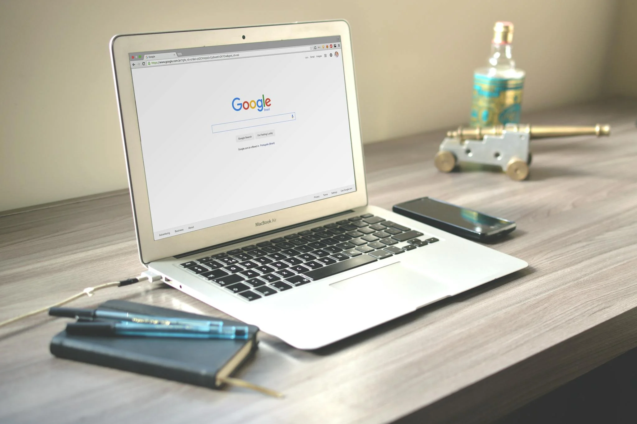 Macbook on Table with Google on the screen