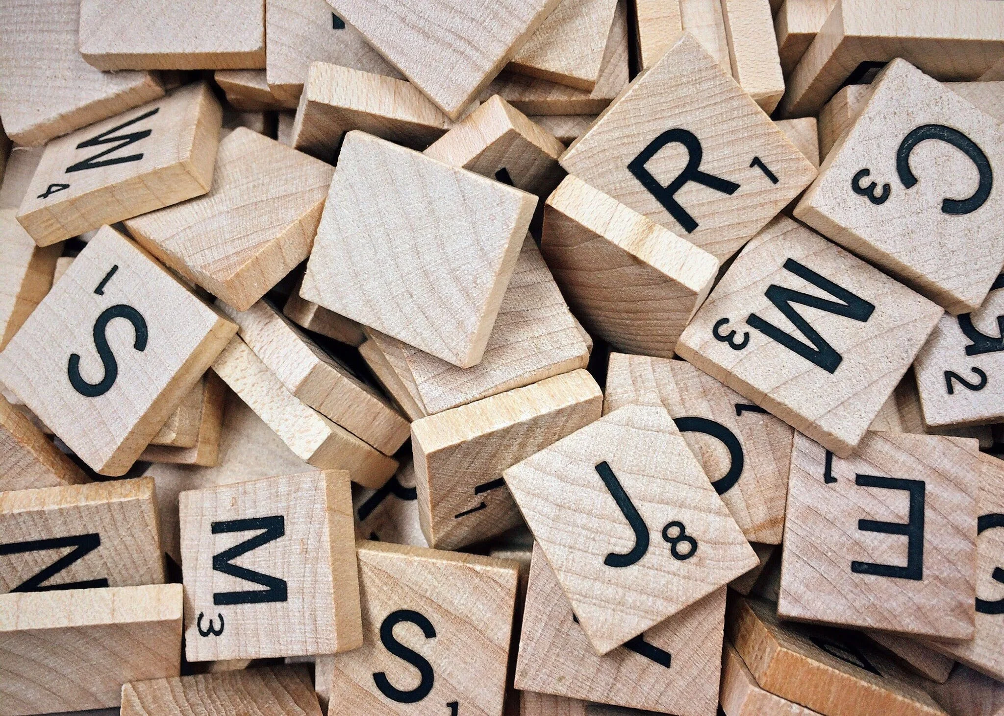 Brown Scrabble peices With Letters